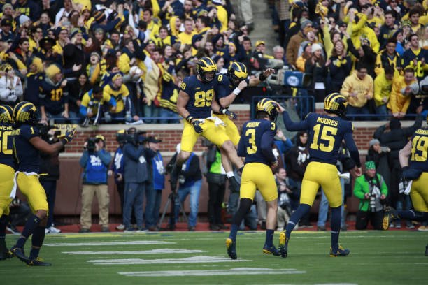 John O'Korn and Ian Bunting celebrate a touchdown against Ohio State in Michigan Stadium.