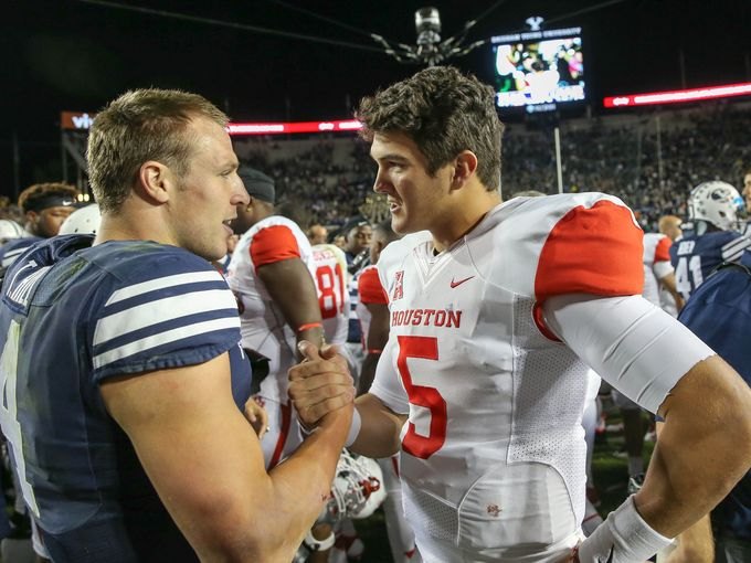 John O'Korn and Taysom Hill shake hands after BYU defeats Houston in Provo, Utah.