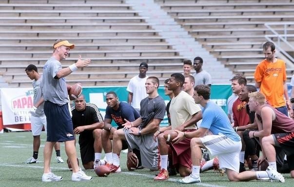 John O'Korn, Dak Prescott, Jameis Winston, Trevor Knight, and other college quarterbacks receive instruction from Peyton Manning at the Manning Passing Academy.
