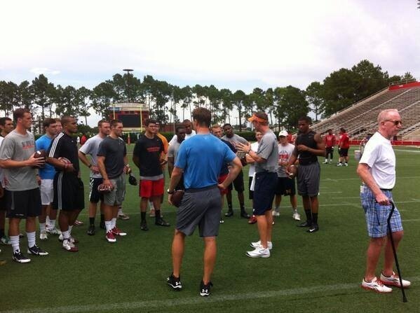 John O'Korn, Dak Prescott, Trevor Knight, and other college quarterbacks receive instruction from Peyton Manning and Eli Manning at the Manning Passing Academy.