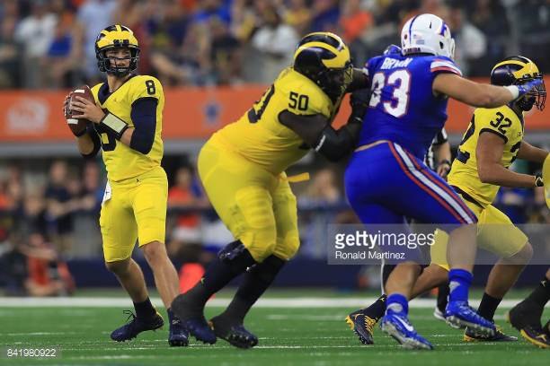 John O'Korn drops back to pass against the Florida Gators at AT&T Stadium in week one of the 2017 season.