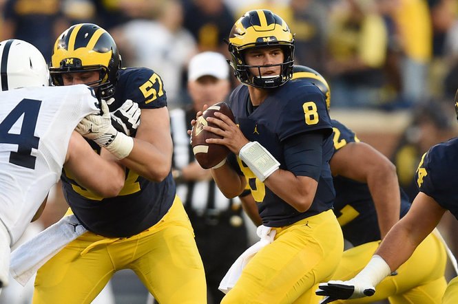 John O'Korn drops back to pass against Penn State at Michigan Stadium.