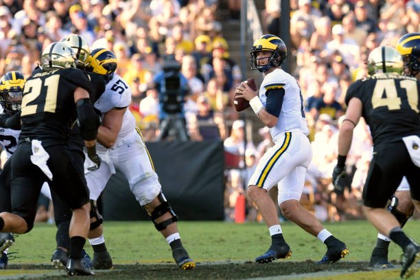 John O'Korn drops back to pass against Purdue.