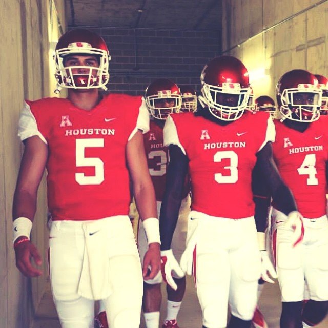 John O'Korn enters the stadium with receivers Deontay Greenberry and Daniel Spencer.