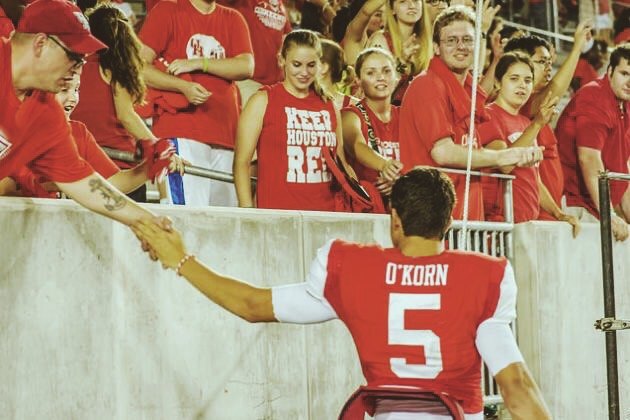 John O'Korn high fives a fan after a game at the University of Houston.