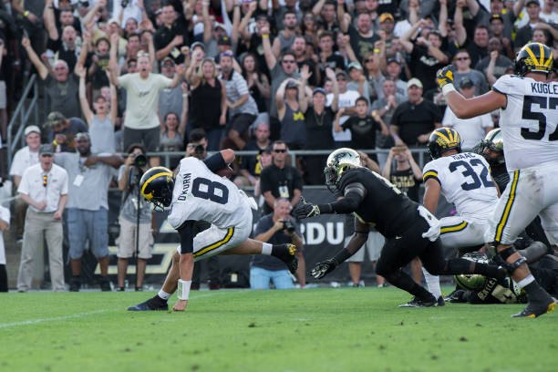 John O'Korn keeps his balance while evading a sack against Purdue.