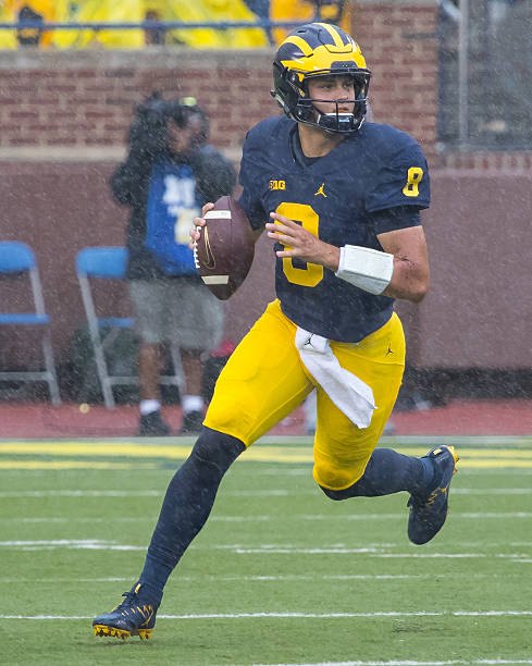 John O'Korn looks downfield during a rainy game against UCF.