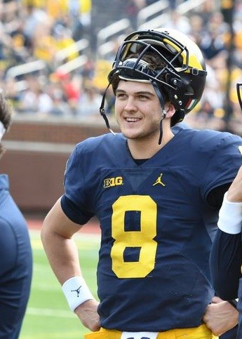 John O'Korn smiles on the field at Michigan Stadium during the 2016 Michigan spring game.