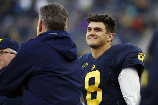 John O'Korn smiles on the field at Michigan Stadium before the 2016 spring game.