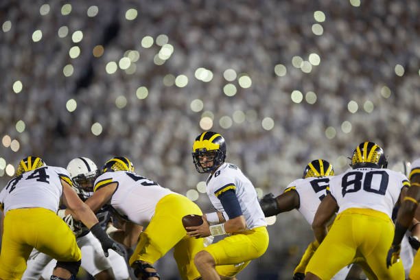 John O'Korn turns to hand the ball off during a game against Penn State during a White Out game  at Beaver Stadium.